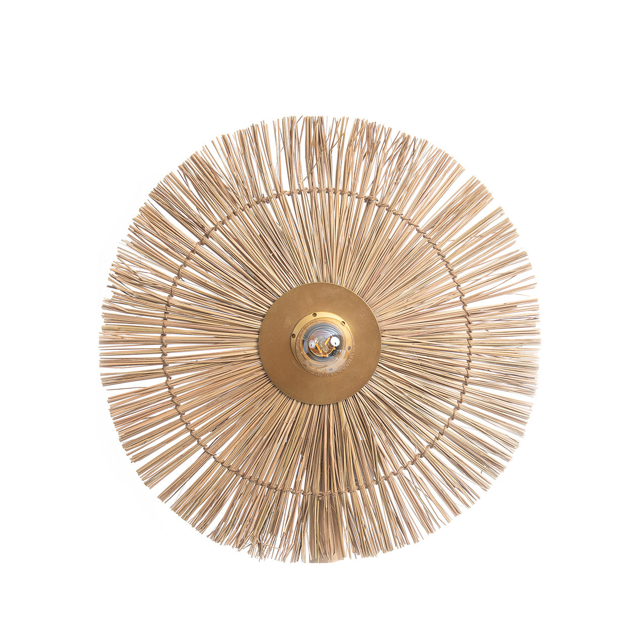 Round rattan woven wall art piece with a central light fixture on a white background
