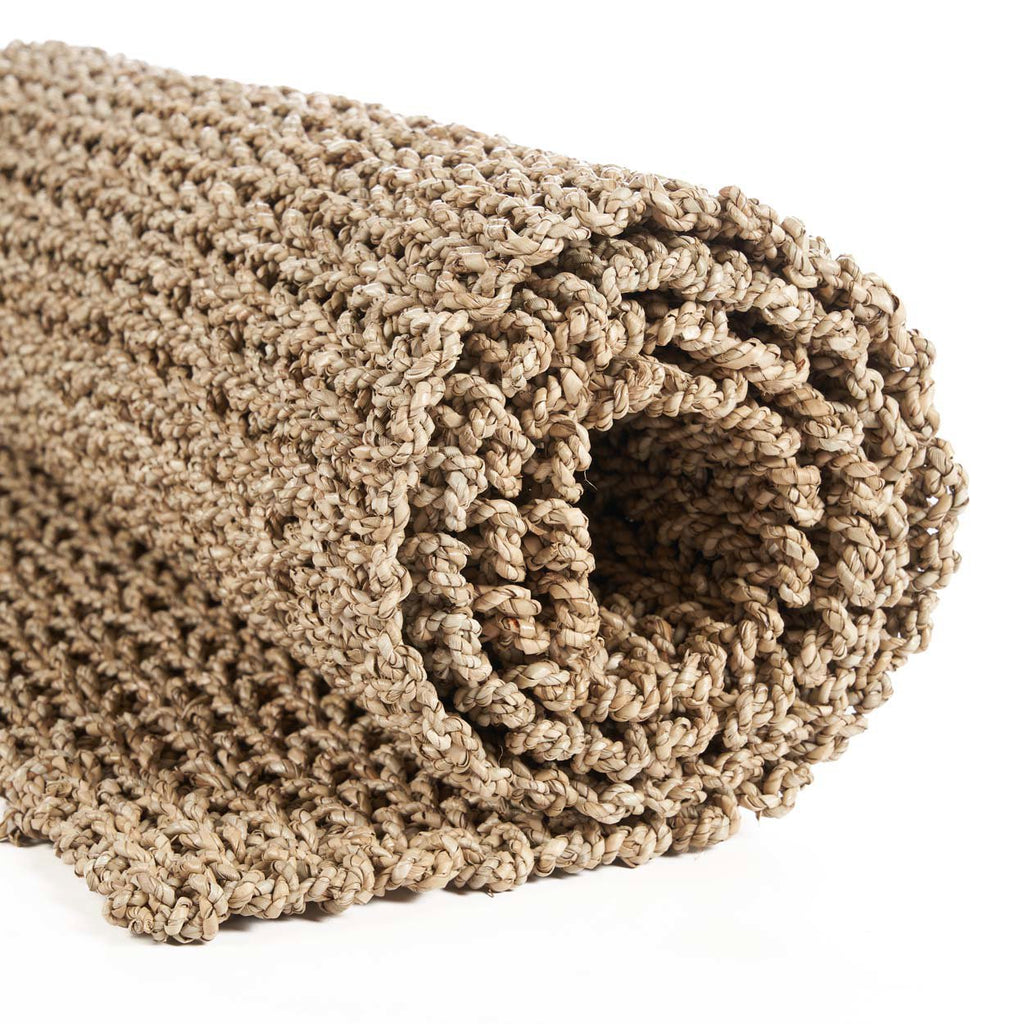 A hand made floor runner hand made in Bali on a white background