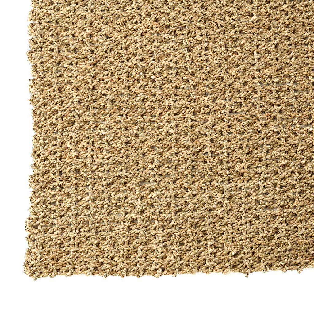 Natural woven hand made rug on a white background